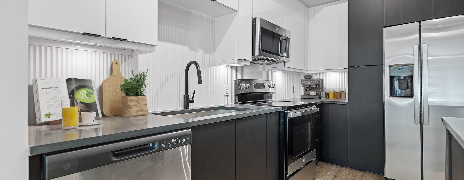 Kitchen with sink, microwave, and refrigerator 